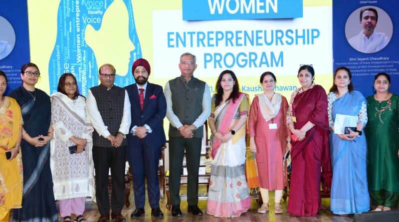 a group of people standing in front of a sign Women Entrepreneurship