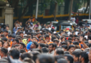 a large crowd of Indians shows Unemployment in India